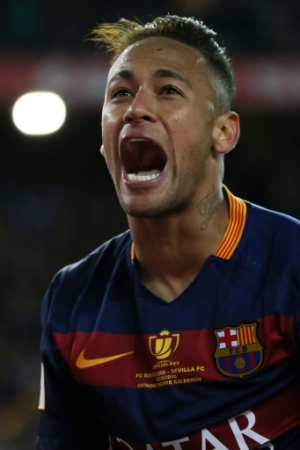 Barcelona's Brazilian forward Neymar celebrates at the end of the Spanish "Copa del Rey" (King's Cup) final match FC Barcelona vs Sevilla FC at the Vicente Calderon stadium in Madrid on May 22, 2016.