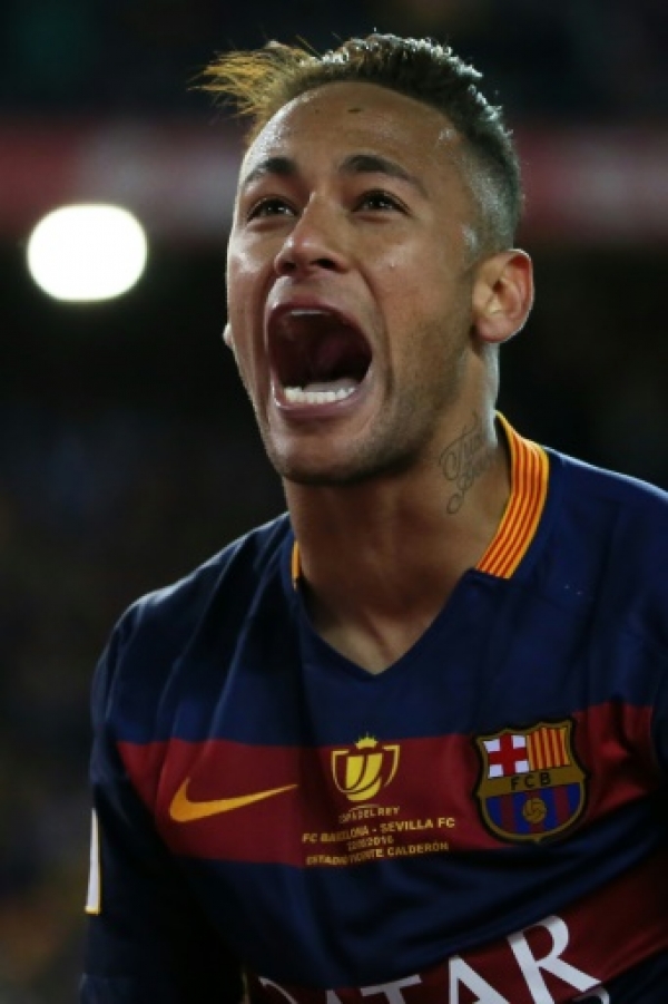 Barcelona's Brazilian forward Neymar celebrates at the end of the Spanish "Copa del Rey" (King's Cup) final match FC Barcelona vs Sevilla FC at the Vicente Calderon stadium in Madrid on May 22, 2016.