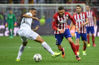 Real Madrid's Brazilian defender Danilo (L) and Atletico Madrid's Belgian forward Yannick Ferreira Carrasco fight for the ball during the UEFA Champions League final football match between Real Madrid and Atletico Madrid at San Siro Stadium in Milan, on May 28, 2016.