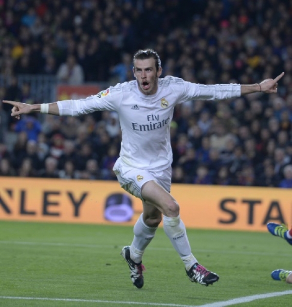 Real Madrid's Welsh forward Gareth Bale celebrates his disallowed goal during the Spanish league "Clasico" football match FC Barcelona vs Real Madrid CF at the Camp Nou stadium in Barcelona on April 2, 2016.