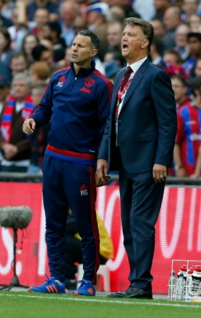 Manchester United's Dutch manager Louis van Gaal (R) and Manchester United's Welsh assistant manager Ryan Giggs watch the action during the English FA Cup final football match between Crystal Palace and Manchester United at Wembley stadium in London on May 21, 2016.