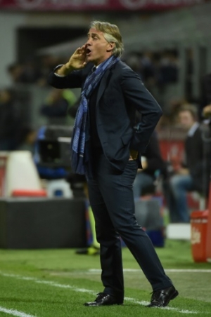 Inter Milan's coach from Italy Roberto Mancini gestures during the Italian Serie A football match Inter Milan vs Naples on April 16, 2016 at the San Siro Stadium in Milan.