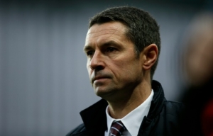 Aston Villa's French manager Remi Garde reacts during the English Premier League football match between Aston Villa and Arsenal at Villa Park in Birmingham, central England on December 13, 2015. AFP PHOTO / ADRIAN DENNIS RESTRICTED TO EDITORIAL USE. No use with unauthorized audio, video, data, fixture lists, club/league logos or 'live' services. Online in-match use limited to 75 images, no video emulation. No use in betting, games or single club/league/player publications.