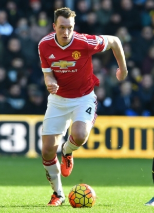 Manchester United's English defender Phil Jones (L) vies with Watford's Nigerian striker Odion Ighalo during the English Premier League football match between Watford and Manchester United at Vicarage Road Stadium in Watford, north of London on November 21, 2015. AFP PHOTO / BEN STANSALL RESTRICTED TO EDITORIAL USE. No use with unauthorized audio, video, data, fixture lists, club/league logos or 'live' services. Online in-match use limited to 75 images, no video emulation. No use in betting, games or single club/league/player publications.