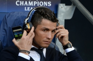 Real Madrid's Portuguese forward Cristiano Ronaldo sits in the dug-out ahead of kick off of the UEFA Champions League semi-final first leg football match between Manchester City and Real Madrid at the Etihad Stadium in Manchester, northwest England, on April 26, 2016.Real Madrid superstar Cristiano Ronaldo was unexpectedly left out of the squad for his side's Champions League semi-final first leg at Manchester City on April 26. Ronaldo was declared fit by head coach Zinedine Zidane on April 25, despite having missed Saturday's 3-2 win at Rayo Vallecano with a thigh strain, and trained with his team-mates on the eve of the game. But he was not even included in the squad to face City, with Spanish winger Lucas Vazquez taking his place in the starting XI at the Etihad Stadium.