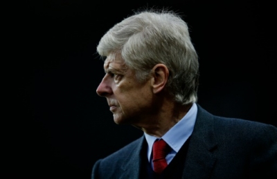 Arsenal's French manager Arsene Wenger watches his players during the English Premier League football match between Aston Villa and Arsenal at Villa Park in Birmingham, central England on December 13, 2015. AFP PHOTO / ADRIAN DENNIS RESTRICTED TO EDITORIAL USE. No use with unauthorized audio, video, data, fixture lists, club/league logos or 'live' services. Online in-match use limited to 75 images, no video emulation. No use in betting, games or single club/league/player publications.