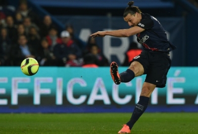 Paris Saint-Germain's Swedish forward Zlatan Ibrahimovic shots during the French L1 football match between Paris Saint-Germain (PSG) and AS Monaco at the Parc des Princes stadium in Paris on March 20, 2016.