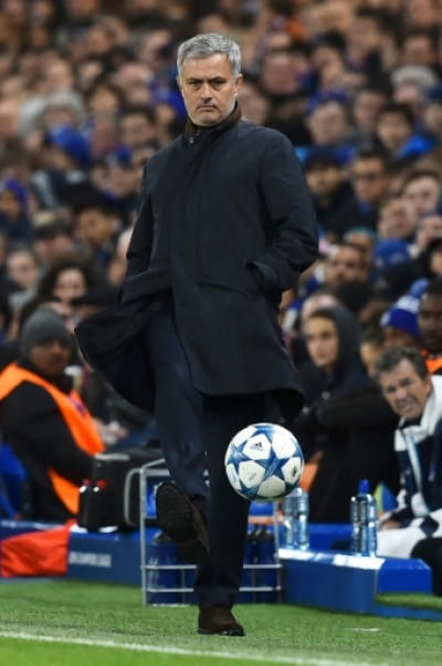(FILES) A picture taken on December 9, 2015 shows Chelsea's Portuguese manager Jose Mourinho kicking a ball during the UEFA Champions League Group G football match between Chelsea and Porto at Stamford Bridge in London. Chelsea manager Jose Mourinho has been sacked after a disastrous start to the Premier League season on December 17, 2015. AFP PHOTO / BEN STANSALL