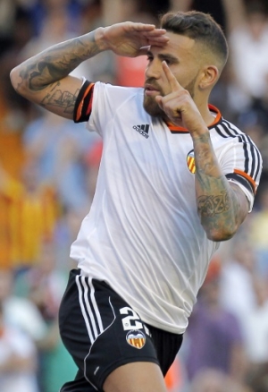 (FILES) A picture taken on May 17, 2015 shows Valencia's Argentinian defender Nicolas Otamendi celebrating after scoring against Celta de Vigo at the Mestalla stadium in Valencia. Argentine international and Valencia defender has signed on August 20, 2015 for Manchester City for an undisclosed sum. AFP PHOTO / JOSE JORDAN