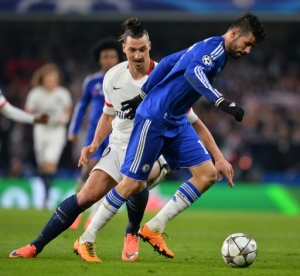 Chelsea's Brazilian-born Spanish striker Diego Costa (R) takes on Paris Saint-Germain's Swedish forward Zlatan Ibrahimovic (L) during the UEFA Champions League round of 16 second leg football match between Chelsea and Paris Saint-Germain (PSG) at Stamford Bridge in London on March 9, 2016.