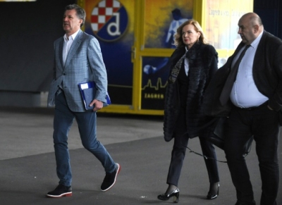 Dinamo Zagreb football chief Zdravko Mamic (L) arrives with his lawyers Jadranka Slokovic (C) and Cedo Prodanovic to a press conference where he announced his resignation at the club's headquarters, in Zagreb, on February 9, 2016. Dinamo Zagreb chief Zdravko Mamic resigned on February 9, 2016 a day after Croatian national anti-graft prosecutors opened another multi-million-euro probe against him. On February 8, the national anti-graft USKOK bureau said it was probing Mamic and six other people including his brother Zoran, who is Dinamo coach, son Mario and former director Damir Vrbanovic. They are alleged to have embezzled nearly 70 million kunas (nine million euros, $10.3 million) of Dinamo Zagreb's money through fictitious deals related to player transfers.
