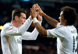 (Arquivo) Os jogadores Gareth Bale (E) e Marcelo, do Real Madrid, durante partida contra o Real Valladolid, em Madri, no dia 30 de novembro de 2013