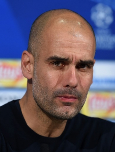 Bayern Munich's Spanish headcoach Pep Guardiola addresses a press conference on the eve of the Champions League semi final, second-leg football match between Bayern Munich and Atletico Madrid at the arena in Munich, southern Germany, on May 2, 2016.
