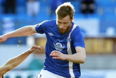 Molde's Jo Inge Berget (R) vies for the ball with Rubin Kazan's Roman Eremenko during the UEFA Europa League qualifying football match Molde FK vs Rubin Kazan in Molde, Norway on August 22, 2013. AFP PHOTO / SVEIN OVE EKORNESVAG/NTB scanpix NORWAY OUT