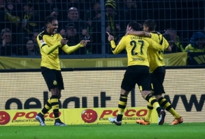 Dortmund's Gabonese striker Pierre-Emerick Aubameyang (L) celebrates with his teammates during the German first division Bundesliga football match of Borussia Dortmund vs FC Ingolstadt 04 in Dortmund, western Germany, on January 30, 2016.