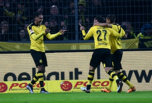 Dortmund's Gabonese striker Pierre-Emerick Aubameyang (L) celebrates with his teammates during the German first division Bundesliga football match of Borussia Dortmund vs FC Ingolstadt 04 in Dortmund, western Germany, on January 30, 2016.