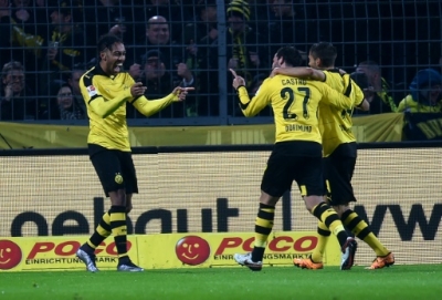Dortmund's Gabonese striker Pierre-Emerick Aubameyang (L) celebrates with his teammates during the German first division Bundesliga football match of Borussia Dortmund vs FC Ingolstadt 04 in Dortmund, western Germany, on January 30, 2016.