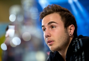 (FILES) This file photo taken on November 24, 2014 shows Bayern Munich's midfielder Mario Gotze addressing a press conference in Manchester, Northwest England, on November 24, 2014, on the eve of the team's UEFA Champions League group E football match against Mancherster City.Euro 2016 represents a challenge for Gotze, little used last season by Bayern Munich.