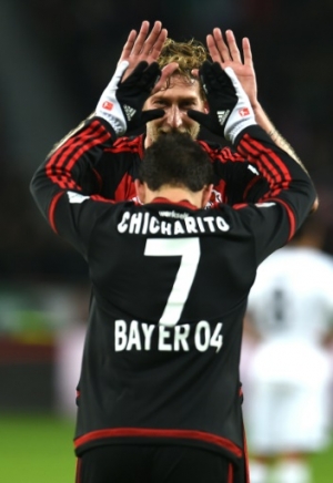 Leverkusen's Mexican striker Javier Hernandez (front) and Leverkusen's forward Stefan Kiessling celebrate after their team's second goal during the German first division Bundesliga football match Bayer 04 Leverkusen vs Borussia Moenchengladbach in Leverkusen, western Germany, on December 12, 2015. AFP PHOTO / PATRIK STOLLARZ RESTRICTIONS: DURING MATCH TIME: DFL RULES TO LIMIT THE ONLINE USAGE TO 15 PICTURES PER MATCH AND FORBID IMAGE SEQUENCES TO SIMULATE VIDEO. == RESTRICTED TO EDITORIAL USE == FOR FURTHER QUERIES PLEASE CONTACT DFL DIRECTLY AT + 49 69 650050.Leverkusen's Mexican striker Javier Hernandez (front) and Leverkusen's forward Stefan Kiessling celebrate after their team's second goal during the German first division Bundesliga football match Bayer 04 Leverkusen vs Borussia Moenchengladbach in Leverkusen, western Germany, on December 12, 2015. AFP PHOTO / PATRIK STOLLARZ RESTRICTIONS: DURING MATCH TIME: DFL RULES TO LIMIT THE ONLINE USAGE TO 15 PICTURES PER MATCH AND FORBID IMAGE SEQUENCES TO SIMULATE VIDEO. == RESTRICTED TO EDITORIAL USE == FOR FURTHER QUERIES PLEASE CONTACT DFL DIRECTLY AT + 49 69 650050.
