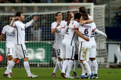 Paris Saint-Germain's Swedish forward Zlatan Ibrahimovic (2nd R) celebrates with teammates after scoring a goal during the French L1 football match between Caen (SM Caen) and Paris Saint-Germain (PSG), on December 19, 2015 at the Michel d'Ornano stadium, in Caen, northwestern France. Paris Saint-Germain won the match 0-3. AFP PHOTO / CHARLY TRIBALLEAU