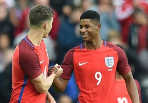England striker Marcus Rashford celebrates after scoring against Australia.
