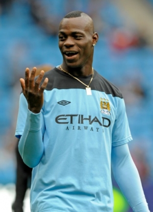 Manchester City's Italian striker Mario Balotelli warming up before the English Premier League football match between Manchester City and Wolverhampton Wanderers at Etihad Stadium in Manchester, north-west England on October 29, 2011. AFP PHOTO/OLLY GREENWOOD RESTRICTED TO EDITORIAL USE. No use with unauthorized audio, video, data, fixture lists, club/league logos or &ldquo;live&rdquo; services. Online in-match use limited to 45 images, no video emulation. No use in betting, games or single club/league/player publications.