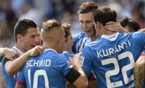 Hoffenheim's player's celebrate after they scored during the German first division Bundesliga football match 1899 Hoffenheim vs FC Bayern Munich, on August 22, 2015 in Sinsheim, southwestern Germany. AFP PHOTO / THOMAS KIENZLE RESTRICTIONS: DURING MATCH TIME: DFL RULES TO LIMIT THE ONLINE USAGE TO 15 PICTURES PER MATCH AND FORBID IMAGE SEQUENCES TO SIMULATE VIDEO. == RESTRICTED TO EDITORIAL USE == FOR FURTHER QUERIES PLEASE CONTACT DFL DIRECTLY AT + 49 69 650050.