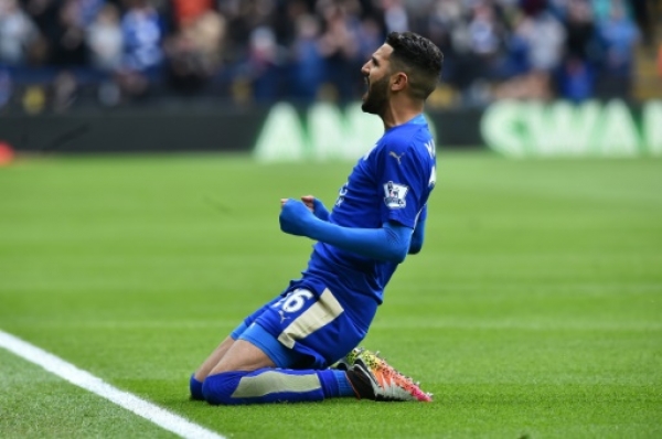 Leicester City's Algerian midfielder Riyad Mahrez celebrates scoring the opening goal during the English Premier League football match between Leicester City and Swansea at King Power Stadium in Leicester, central England on April 24, 2016.