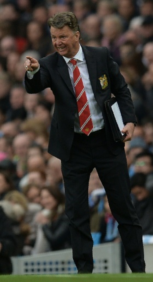 Manchester United's Dutch manager Louis van Gaal shouts instructions to his players from the touchline during the English Premier League football match between Manchester City and Manchester United at the Etihad Stadium in Manchester, north west England, on March 20, 2016.