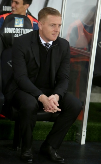 Swansea City&rsquo;s English manager Garry Monk sits in the dugout during the English Premier League football match between Swansea City and Leicester City at The Liberty Stadium in Swansea, south Wales on December 5, 2015. Swansea City&rsquo;s English manager Garry Monk sits in the dugout during the English Premier League football match between Swansea City and Leicester City at The Liberty Stadium in Swansea, south Wales on December 5, 2015. AFP PHOTO / GEOFF CADDICK RESTRICTED TO EDITORIAL USE. No use with unauthorized audio, video, data, fixture lists, club/league logos or 'live' services. Online in-match use limited to 75 images, no video emulation. No use in betting, games or single club/league/player publications.