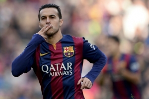 (FILES) A picture taken on December 20, 2014 shows Barcelona's forward Pedro Rodriguez celebrating after scoring against Cordoba. Chelsea on August 19, 2015 agreed a 21 million pounds (30 million euro) deal with Barcelona to sign winger Pedro, beating Manchester United to get the Spanish internatonal, reports said. AFP PHOTO/ JOSEP LAGO