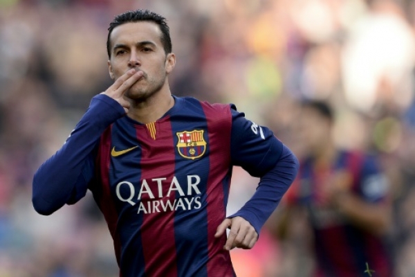 (FILES) A picture taken on December 20, 2014 shows Barcelona's forward Pedro Rodriguez celebrating after scoring against Cordoba. Chelsea on August 19, 2015 agreed a 21 million pounds (30 million euro) deal with Barcelona to sign winger Pedro, beating Manchester United to get the Spanish internatonal, reports said. AFP PHOTO/ JOSEP LAGO