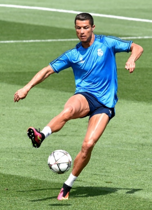 Real Madrid's Cristiano Ronaldo kicks a ball during a training session on the club's Open Media Day at Real Madrid sport city in Madrid.