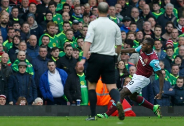 West Ham United's English midfielder Michail Antonio shoots to score the opening goal of the English Premier League football match between West Ham United and Sunderland at The Boleyn Ground in Upton Park, in east London on February 27, 2016.
