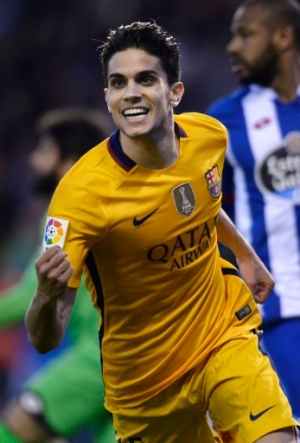 Barcelona's defender Marc Bartra celebrates after scoring a goal during the Spanish league football match RC Deportivo de la Coruna vs FC Barcelona at the Municipal de Riazor stadium in La Coruna on April 20, 2016. Barcelona won the match 8-0.