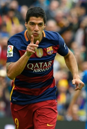 Barcelona's Uruguayan forward Luis Suarez celebrates after scoring a goal during the Spanish league football match FC Barcelona vs RCD Espanyol at the Camp Nou stadium in Barcelona on May 8, 2016.