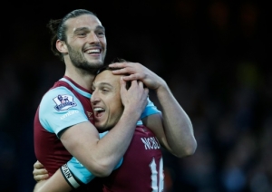 West Ham United's English striker Andy Carroll (L) celebrates with West Ham United's English midfielder Mark Noble after scoring during the English Premier League football match between West Ham United and Watford at The Boleyn Ground in Upton Park, in east London on April 20, 2016.