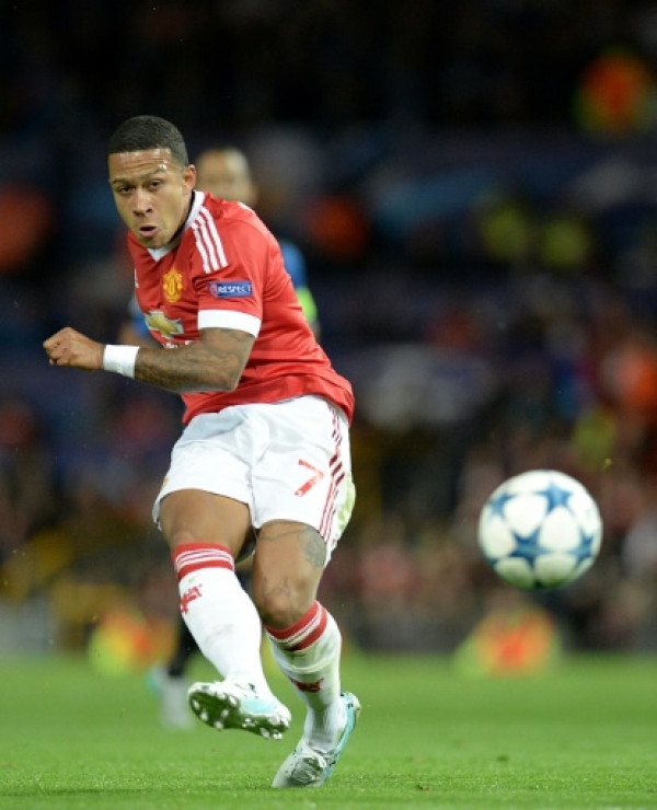 Manchester United's Dutch midfielder Memphis Depay in action during the UEFA Champions League play off football match between Manchester United and Club Brugge at Old Trafford in Manchester, north west England, on August 18, 2015. AFP PHOTO / OLI SCARFF