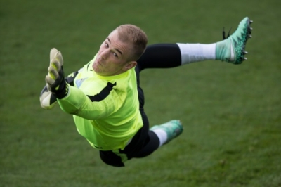 Manchester City's English goalkeeper Joe Hart takes part in a team training session at in Manchester, North West England on April 5, 2016. Manchester City will play Paris Saint-Germain in their UEFA Champions League quarter final, first-leg football match on April 6.